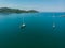 Aerial view of white Yacht in deep blue sea with beautiful landscape view in Kuala Abai, Kota Belud, Sabah, Malaysia