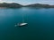 Aerial view of white Yacht in deep blue sea with beautiful landscape view in Kuala Abai, Kota Belud, Sabah, Malaysia