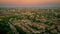 Aerial view of the Whitestone Walk, Hampstead with tall buildings and trees at sunset