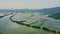 Aerial view wide river under flood against mountains