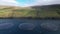 Aerial view of wild salmon in round meshes in the Faroe Islands