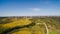 Aerial view of Wind Generating stations in green fields on a background of blue sky. Portugal.