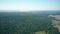 Aerial view of wind generators against smoking stacks of a traditional power plant. Green energy production, new and old