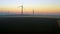 Aerial view of Wind turbines Energy Production. wind mill shot on sunrise. Wind energy farm. Eolian generators in a beautiful whea