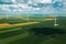 Aerial view of wind turbines on modern wind farm from drone pov