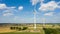 Aerial view of wind turbines windmills against the sky with clouds. Alternative ecological energy production in Germany. Change