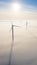 Aerial view of windfarm during winter morning