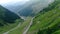 Aerial view winding mountain road in Romania, rise up