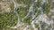 Aerial view of winding road in beautiful mountains at sunset