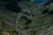 Aerial view of the winding Transfagarasan road on the green hillside