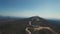 Aerial view of windmills against the sea, laid out on the mountain