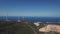 Aerial view of windmills against the sea, laid out on the mountain