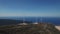 Aerial view of windmills against the sea, laid out on the mountain