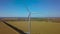 Aerial view of windmills rotating by the force of the wind and generating renewable energy. 4K