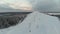 Aerial view winter extreme on ski lodge. The top of the ski resort. Mountain top. 4K