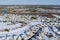 Aerial view winter landscape American town small homecomplex of a snowy winter on the streets after snowfall