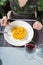 Aerial view of woman eating paella with fork