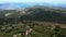 Aerial view of woman hiking on the rocky coast of lake in mountains-002