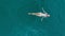 Aerial view of woman relaxing in turquoise water