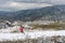 Aerial view on a woman runner on a mountain trail, exercising, jogging.