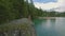 Aerial view of the woman stands on a cliff near Lago di Braies