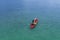 Aerial view of woman traveller exploring calm tropical bay ,Travel and Active Lifestyle concept