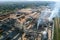 Aerial view of wood processing factory with stacks of lumber at plant manufacturing yard