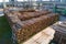 Aerial view of wood processing factory with stacks of lumber at plant manufacturing yard