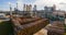 Aerial view of wood processing factory with stacks of lumber at plant manufacturing yard