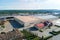 Aerial view of wood processing factory with stacks of lumber at plant manufacturing yard