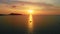 Aerial view of a yacht with beautiful sunset Amazing light sunset or sunrise Sailing boat standing on the small waves at sunset in