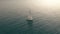 Aerial view. Yacht sailing on opened sea. Sailing boat. Yachting video footage. Yacht from above. Sailboat view from