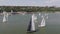 Aerial view on Yachts on an anchor in harbor, boats series. Sail Boats on a beautiful cloudless day in the marina