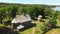 Aerial view Young lithuanians relax on sunday mass by St. Joseph Church in Paluse, Lithuania. Stave Churches in Europe. Old