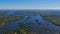 Aerial view of Zambesi River delta ahead of Victoria Falls, bush land and village Livingstone in the background.