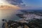 Aerial view of the Zambujeira do Mar village and beach at sunset, in Alentejo