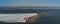 Aerial view of Ã˜resund Oresund Bridge toward Sweden, during a winterly day with parts of baltic sea frozen