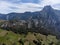 Aerial views of green Liebana valley, houses and mountains, comarca of Cantabria, Spain