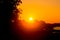 Aerial views of mist sunrises time with the golden glow from the sun shines the sky. Dark biggest tree leaves is an older