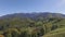 Aerial views of the scenic rural landscape surrounded by Carpathian mountains, Brasov, Romania