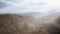 Aerial vulcanic desert landscape with rays of light