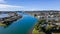 Aerial wide angle view of Hastings River and green Port Macquarie town in New South Wales, Australia