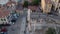 Aerial wide shot of people explore the roman market, Athens, Greece. Aerial circle around the Roman Market.