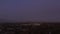 AERIAL: Wide view of Downtown Los Angeles, California Skyline from Culver City at Dusk, Night with Purple Sky