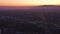 AERIAL: Wide view of Los Angeles, California towards pafific ocean from Culver City at Dusk, Night with Purple Sky and