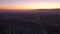 AERIAL: Wide view of Los Angeles, California towards pafific ocean from Culver City at Dusk, Night with Purple Sky and