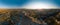 Aerial wide view of Love Valley Peri Bacalari Sunset over Red valley in Cappadocia canyon, mountains and balloons.. Nevsehir