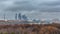 Aerial wiev on Moscow city at cloudy evening: day to night transition time lapse