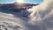 Aerial: Wind-blown snow on crevasse-covered glacier