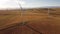 Aerial wind farm revealing shot producing clean energy in rural Alberta